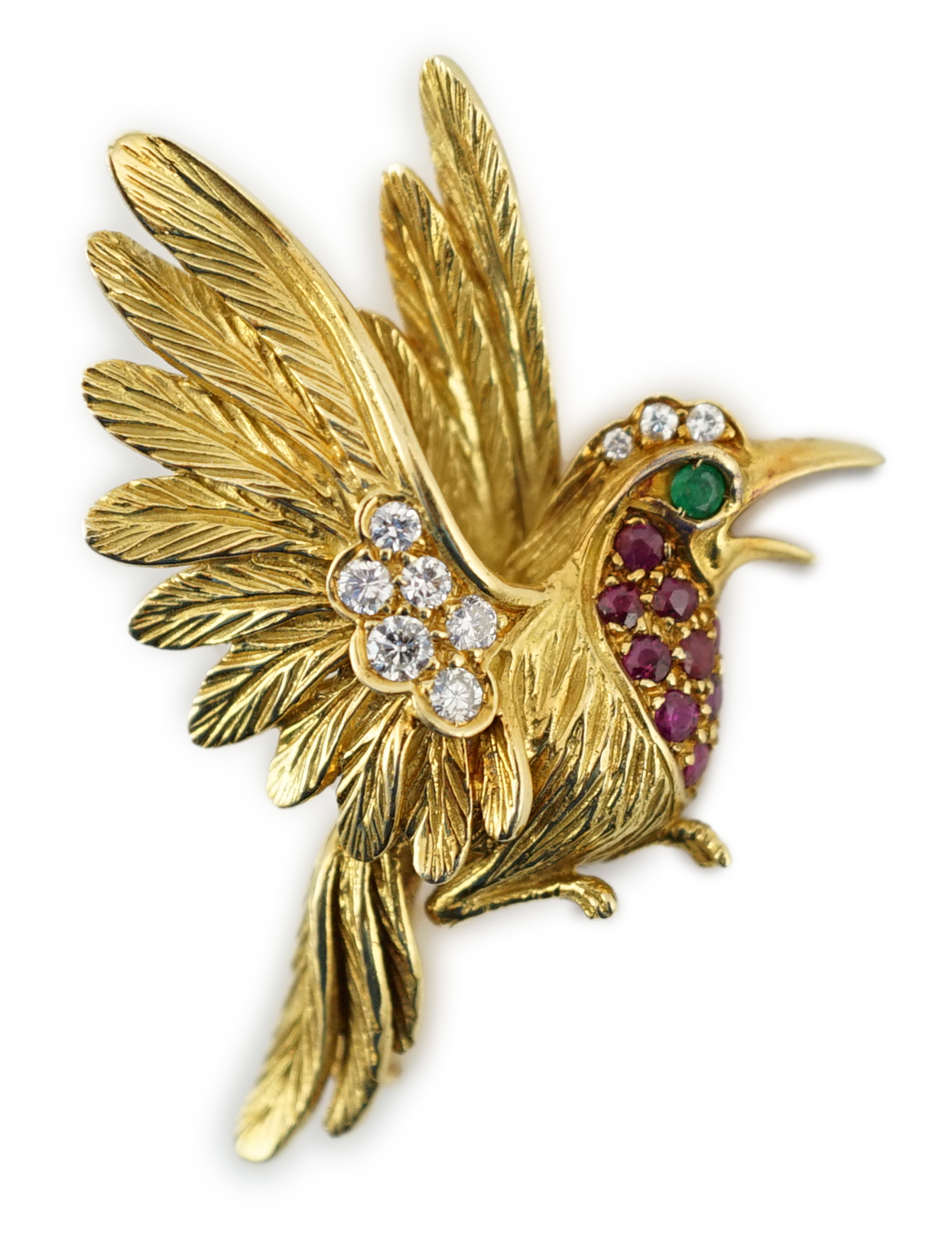 A 20th century French 18ct gold, ruby, emerald and diamond cluster set brooch, modelled as a bird in flight